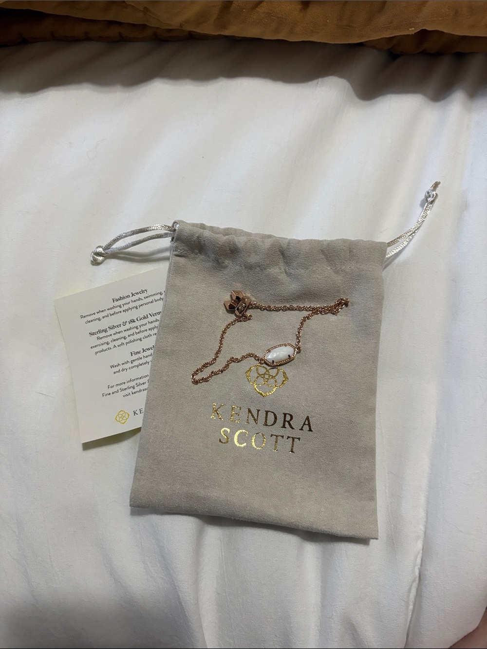 Kendra Scott Rose Gold bracelet with White Stone Pendant